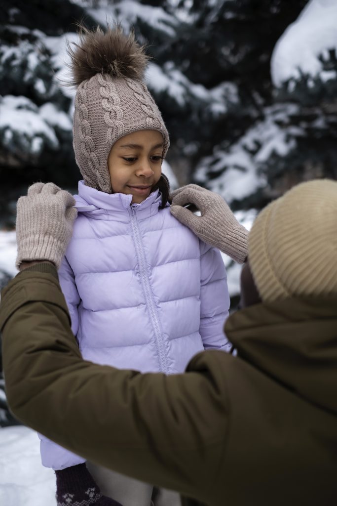 young-father-tying-his-daughter-s-jacked-snowy-winter-day