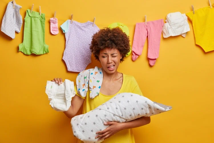 Women with baby clothes