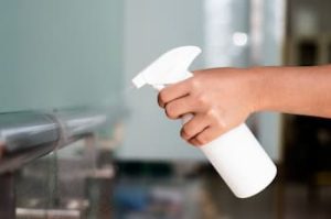 woman-disinfecting-railings-coronavirus-outbreak (1)